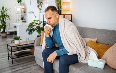 man sick and coughing